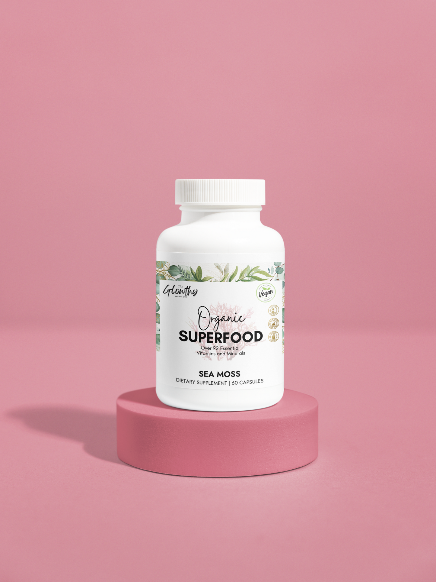 Sea Moss Benefits ORGANIC SUPERFOOD Sea Moss Supplement provides over 92 essential vitamins and minerals in a whole-food bioavailable state to support health, vitality, and energy. (60 Capsules) bottle on a pink stand.