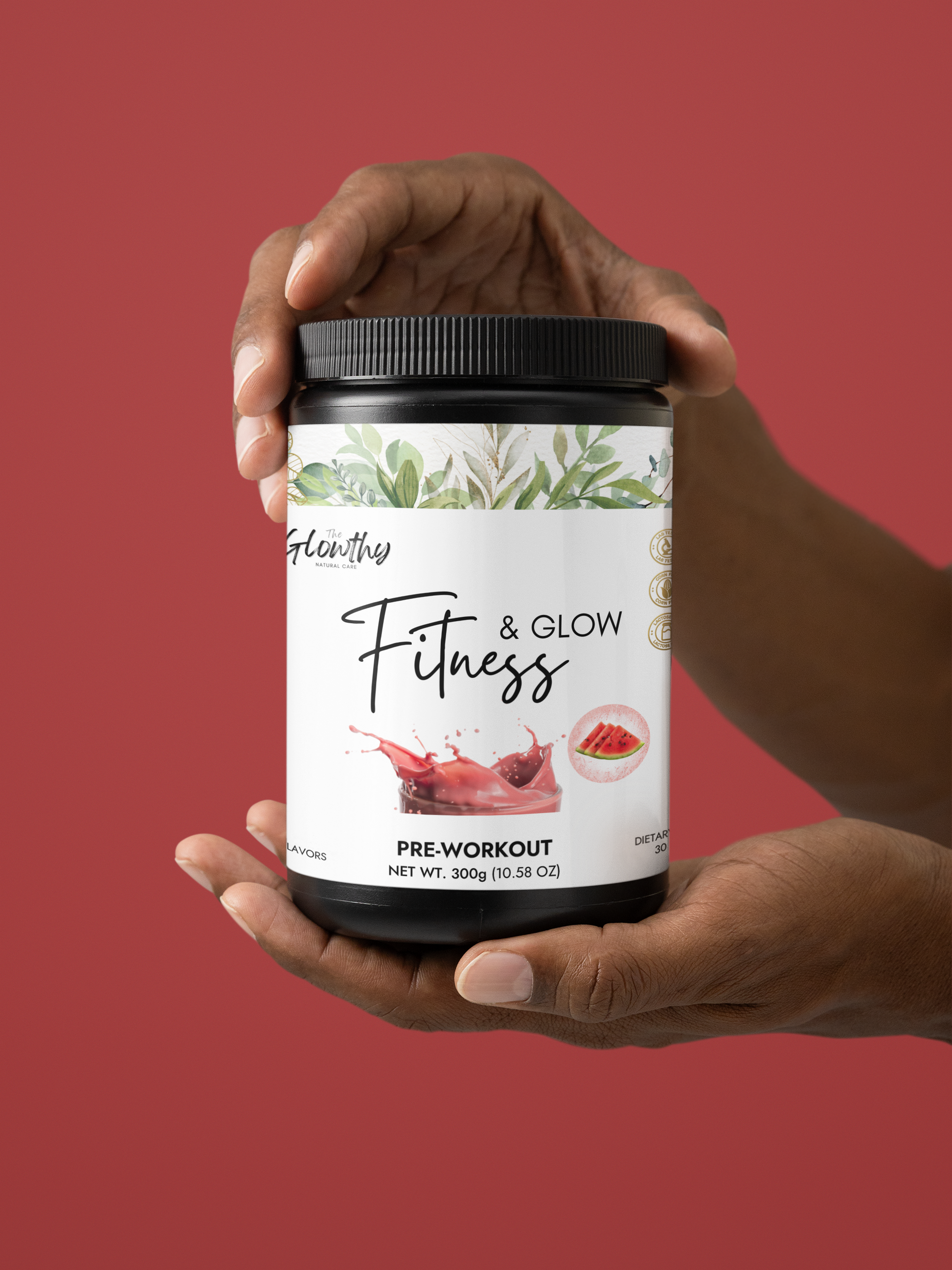 FITNESS & GLOW Pre-Workout Supplement, Watermelon flavor, 300g container held in hands against a red background.