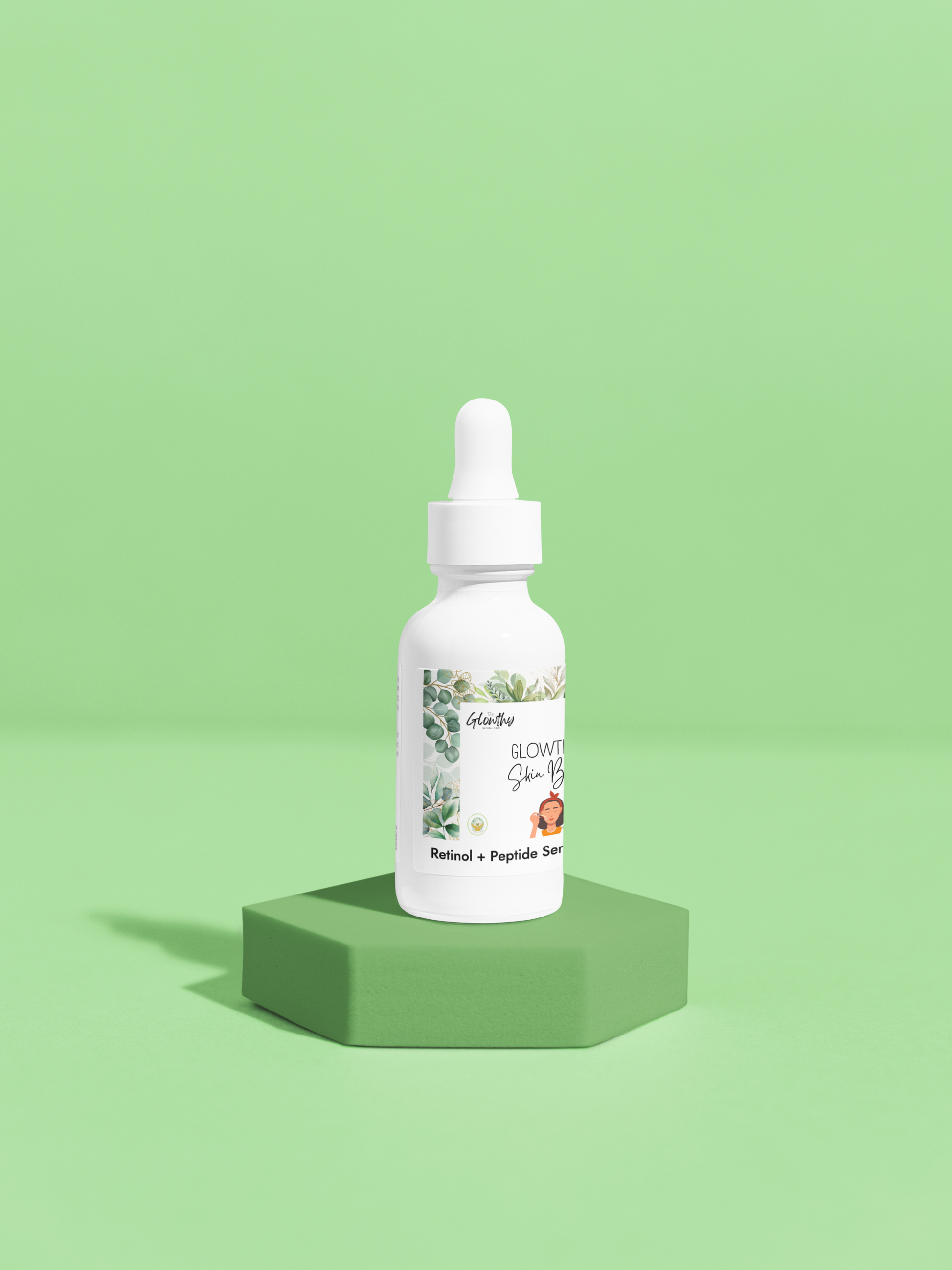 Retinol and Peptide Face Serum in white glass bottle on green background.