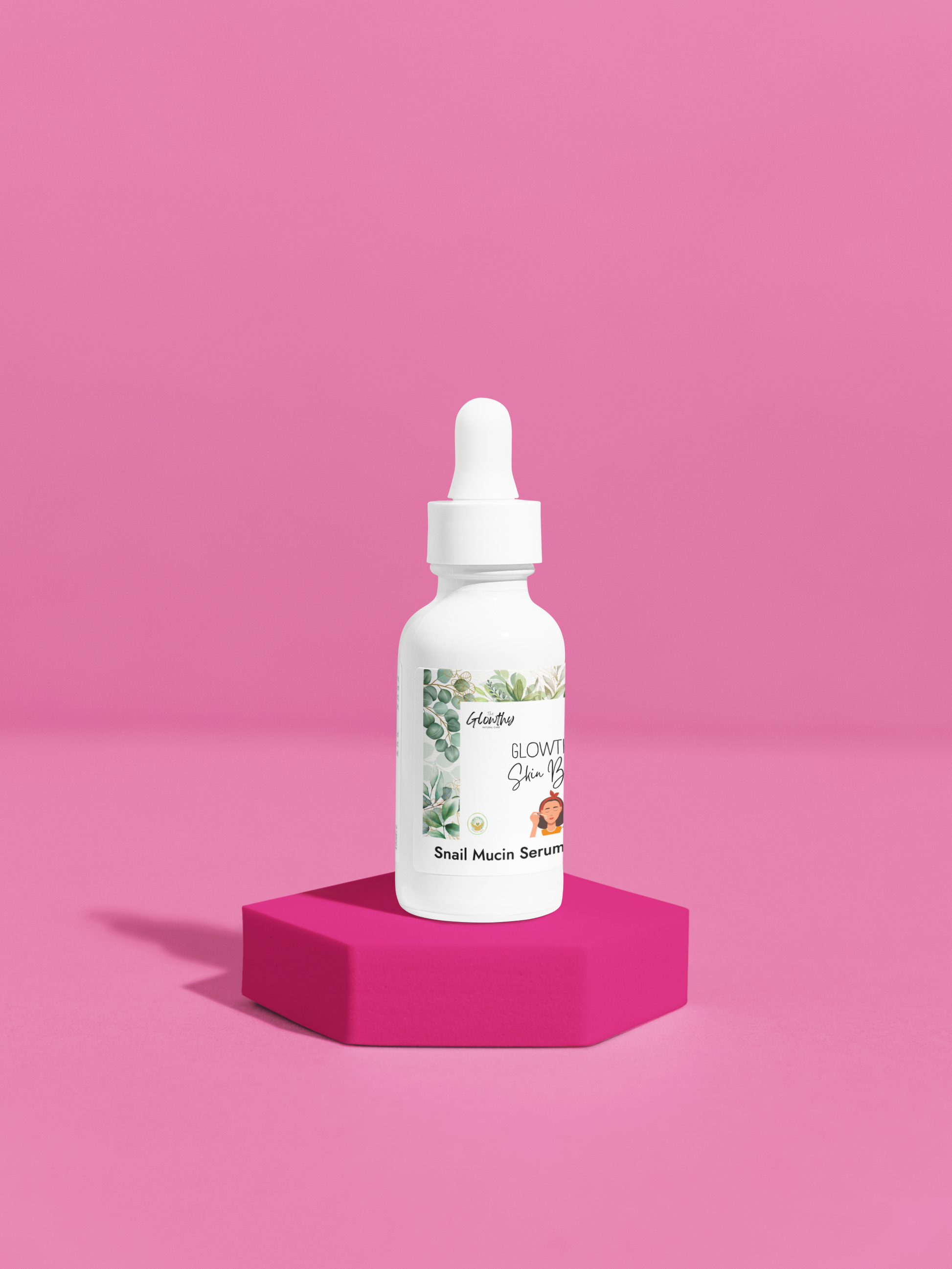 Snail Mucin Facial Serum in white glass bottle with dropper on pink hexagonal stand, promotes hydration and skin brightening.